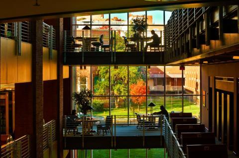 Image of library building interior with people studying